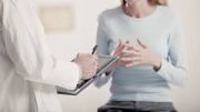 Doctor taking patient notes